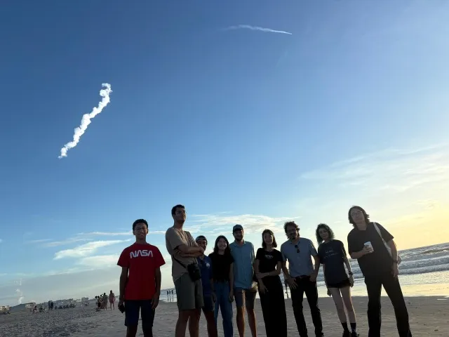Members of Tansu Daylan's AstroMusers on the beach for the launch of the Nancy Grace Roman Space Telescope